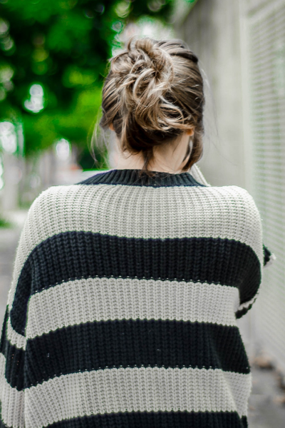 Woman walking down street